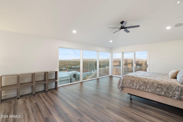 bedroom with access to exterior, dark hardwood / wood-style flooring, and ceiling fan