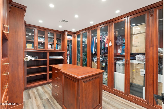 spacious closet featuring light wood-type flooring