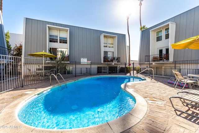 view of swimming pool featuring a patio