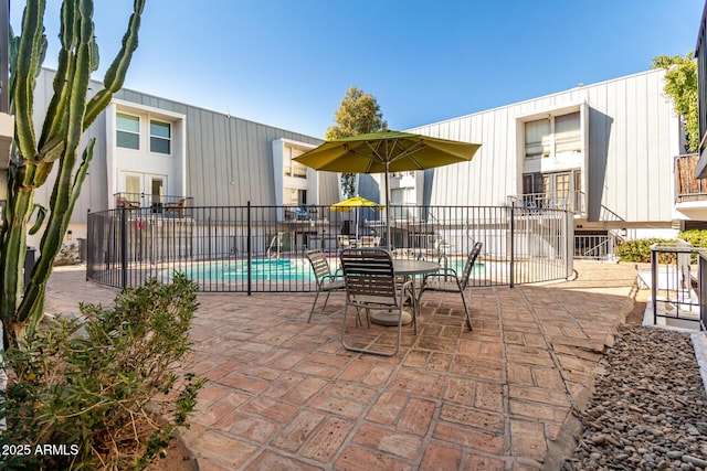 view of patio / terrace featuring a community pool