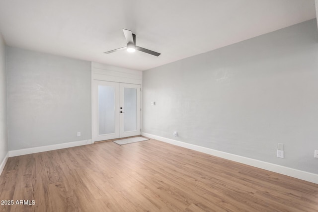 unfurnished room with light hardwood / wood-style floors, french doors, and ceiling fan