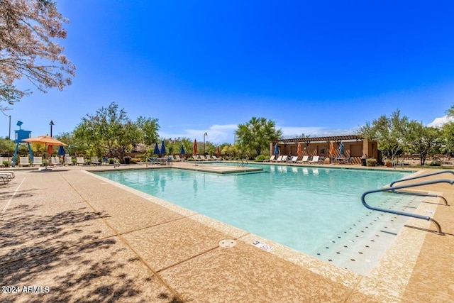 view of swimming pool with a patio area