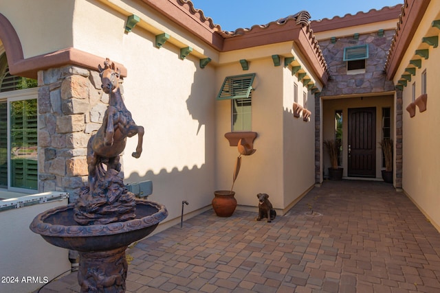 property entrance with a patio