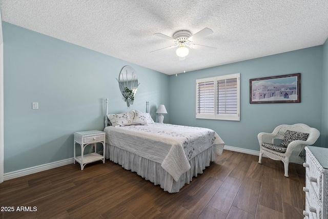 bedroom with a ceiling fan, dark wood-style flooring, a textured ceiling, and baseboards