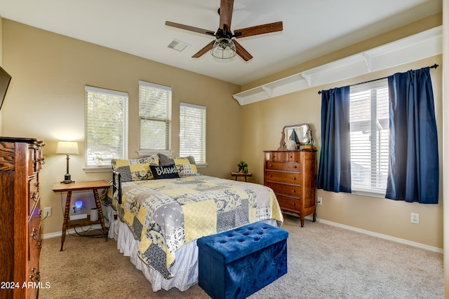 carpeted bedroom with ceiling fan