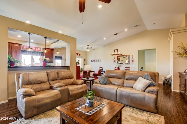 living room with ceiling fan, lofted ceiling, and dark wood-type flooring