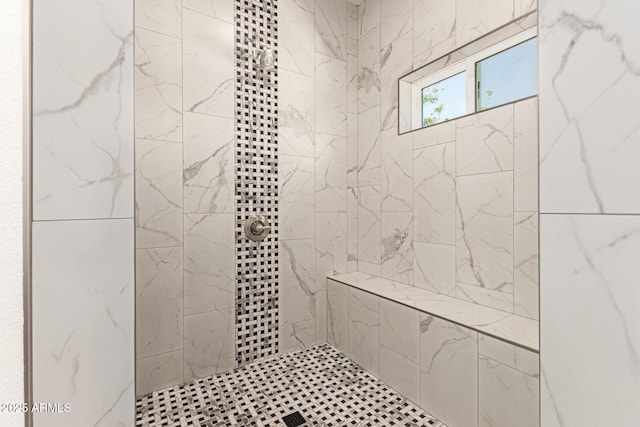 full bathroom with a tile shower