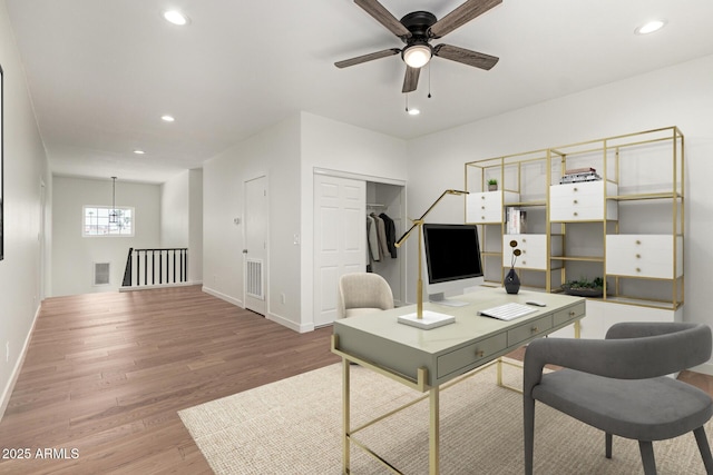 office space featuring recessed lighting, baseboards, visible vents, and light wood-type flooring