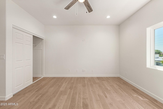 unfurnished bedroom with ceiling fan, recessed lighting, baseboards, light wood-type flooring, and a closet
