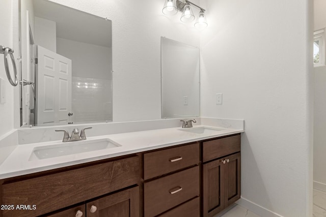 bathroom with double vanity and a sink