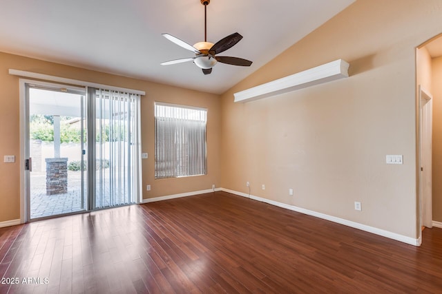 spare room with ceiling fan, dark hardwood / wood-style flooring, and vaulted ceiling