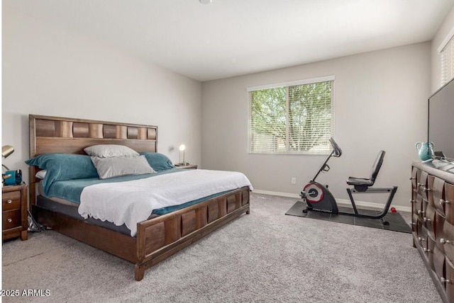bedroom with carpet and baseboards