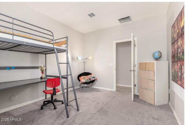 carpeted bedroom with baseboards and visible vents