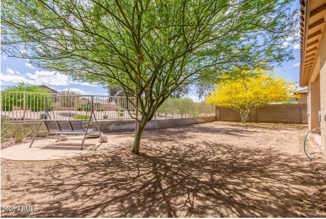 view of yard featuring a patio and a fenced backyard