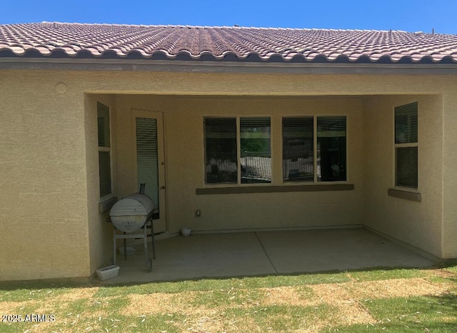 2167 W Ethan Ct, San Tan Valley, AZ 85144 - rear view of house featuring a tiled roof, a patio, and stucco siding