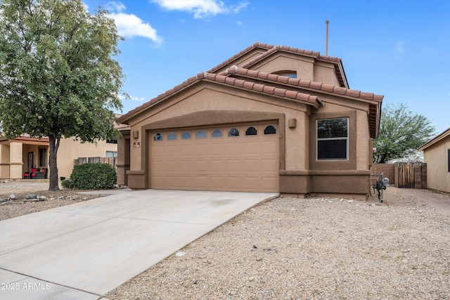 view of front of home featuring a tiled roof, fence, concrete driveway, and stucco siding