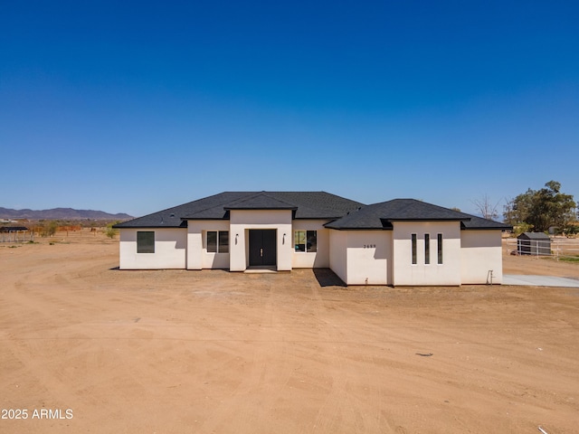2689 S 305th Ave, Buckeye, AZ 85326 - back of property featuring stucco siding, a mountain view, and roof with shingles