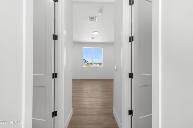 2689 S 305th Ave, Buckeye, AZ 85326 - hall featuring baseboards and wood finished floors