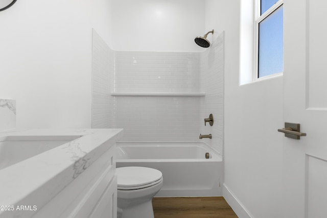 2689 S 305th Ave, Buckeye, AZ 85326 - bathroom featuring toilet, wood finished floors, shower / bathtub combination, vanity, and baseboards