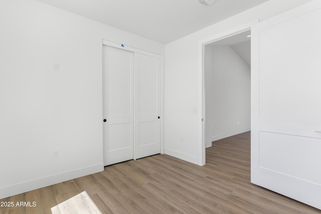 2689 S 305th Ave, Buckeye, AZ 85326 - spare room featuring baseboards and light wood-type flooring