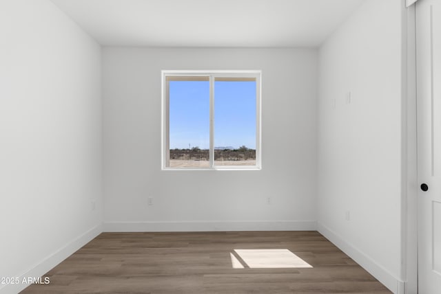 2689 S 305th Ave, Buckeye, AZ 85326 - unfurnished room with baseboards and wood finished floors