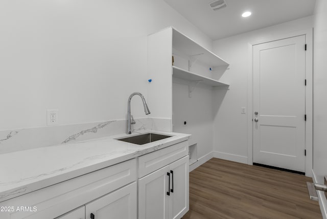 2689 S 305th Ave, Buckeye, AZ 85326 - washroom with a sink, electric dryer hookup, dark wood-style flooring, recessed lighting, and baseboards