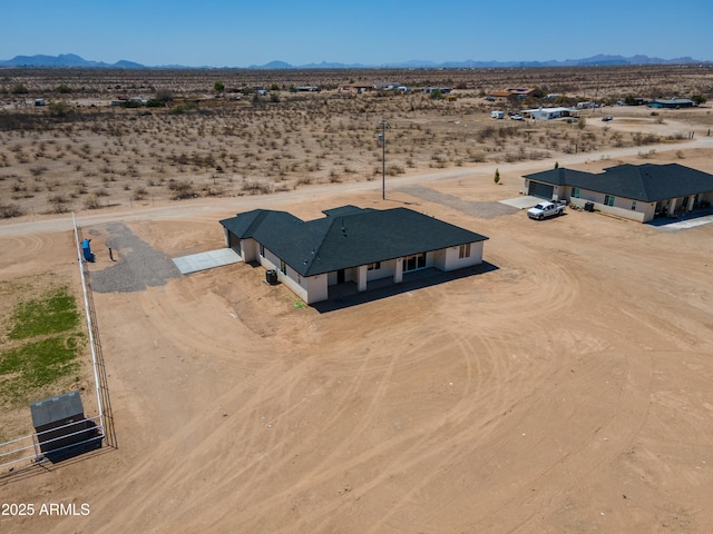 2689 S 305th Ave, Buckeye, AZ 85326 - aerial view of sparsely populated area with a desert landscape and a mountain backdrop