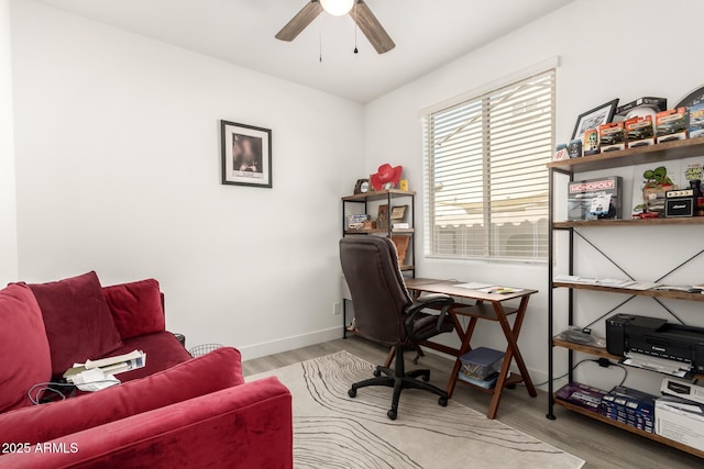 1736 E Joelle Dr, Casa Grande, AZ 85122 - home office with ceiling fan, light wood-style floors, and baseboards