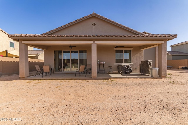 1736 E Joelle Dr, Casa Grande, AZ 85122 - rear view of house with ceiling fan, fence, a patio area, and stucco siding
