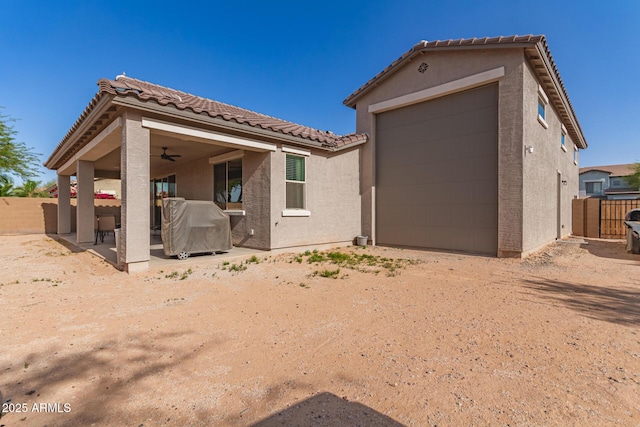 1736 E Joelle Dr, Casa Grande, AZ 85122 - back of property featuring fence, stucco siding, a tile roof, and a patio