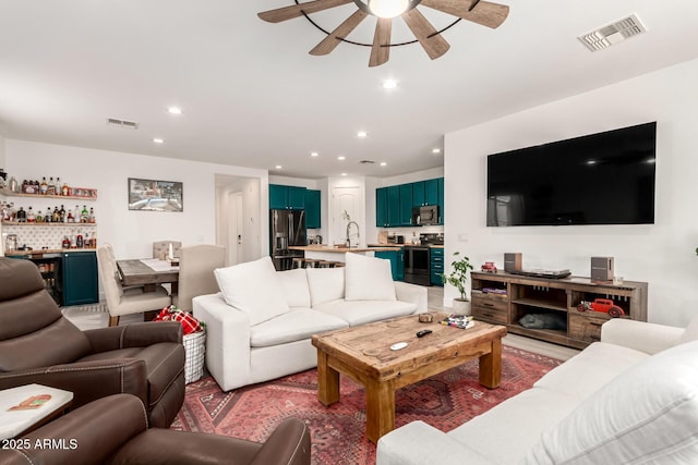 1736 E Joelle Dr, Casa Grande, AZ 85122 - living area with ceiling fan, recessed lighting, and a bar