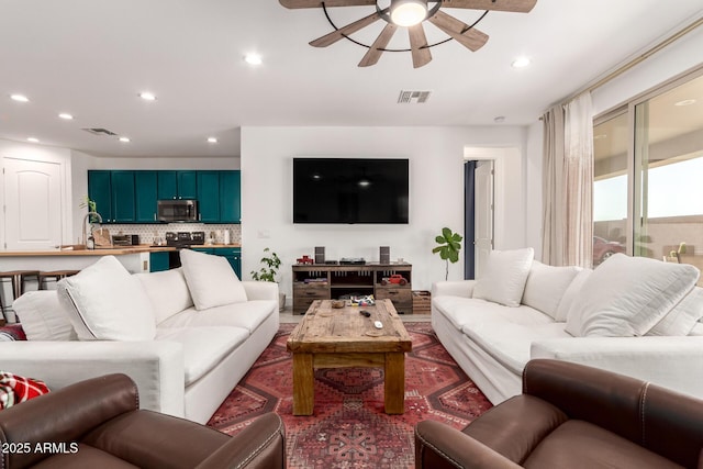 1736 E Joelle Dr, Casa Grande, AZ 85122 - living room featuring a ceiling fan and recessed lighting