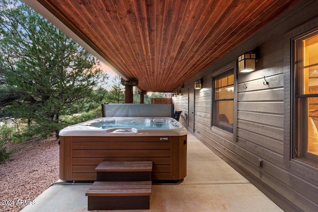 view of patio / terrace with a hot tub