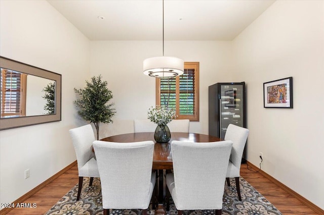 dining space with dark hardwood / wood-style flooring