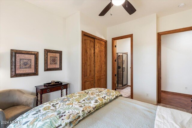 bedroom with ceiling fan, wood-type flooring, and a closet