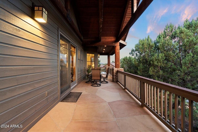 view of balcony at dusk