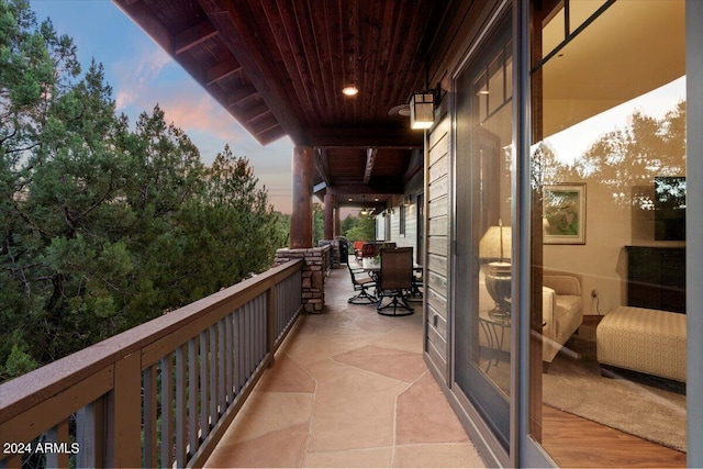 view of balcony at dusk