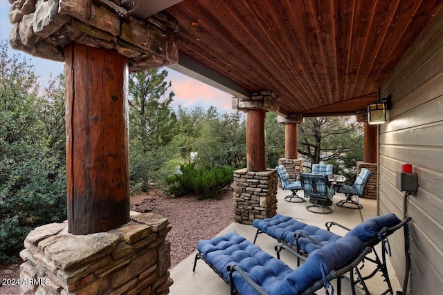 view of patio terrace at dusk