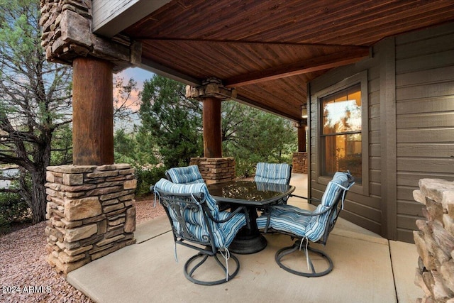 view of patio terrace at dusk