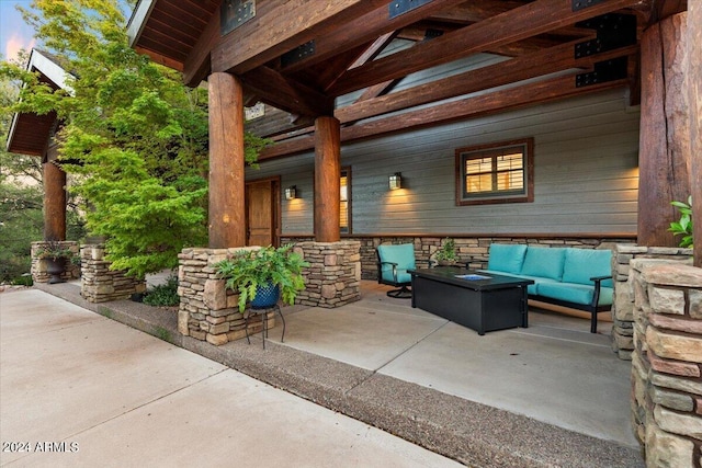 patio terrace at dusk with an outdoor living space