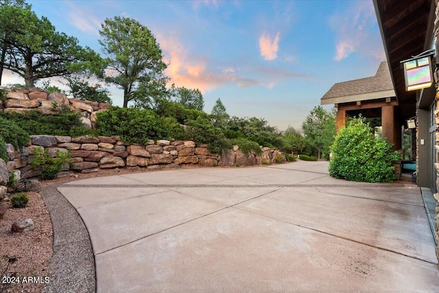 view of patio terrace at dusk