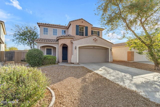 mediterranean / spanish-style house featuring a garage