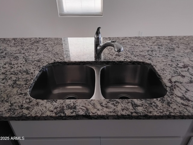 room details with dark stone counters and sink