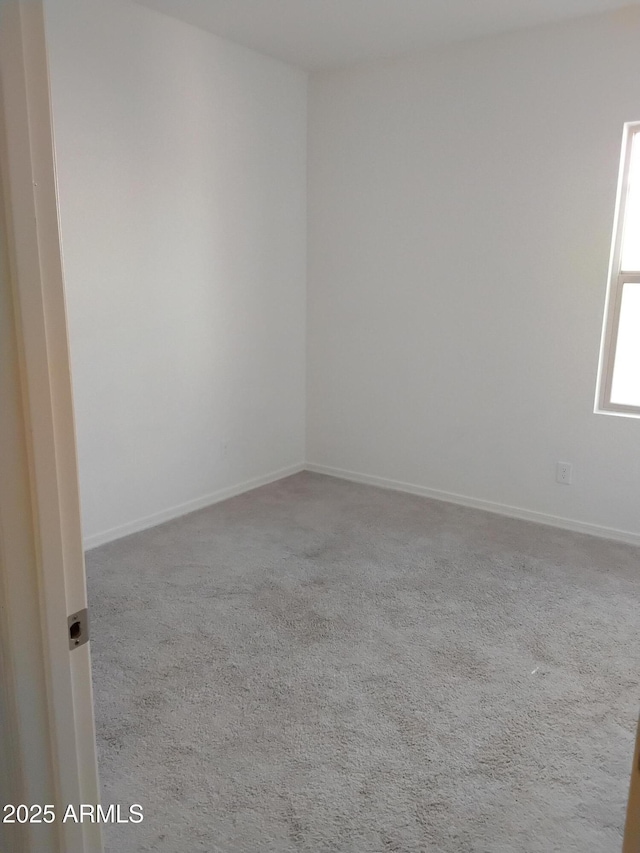 unfurnished room with carpet floors