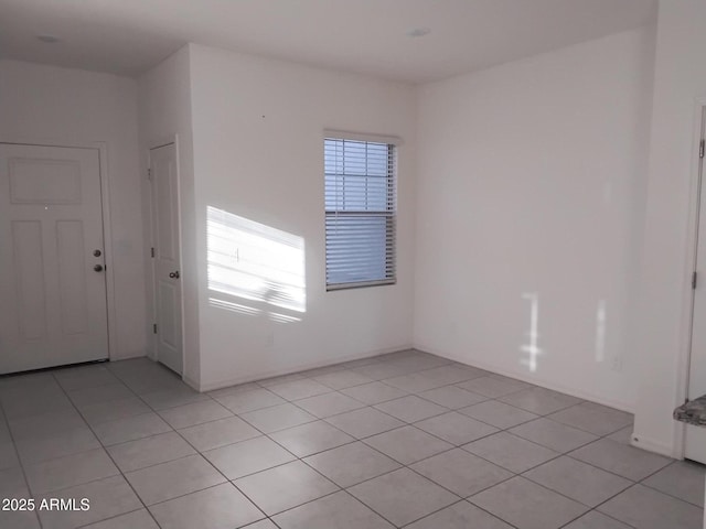 empty room with light tile patterned floors