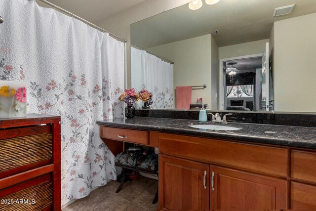 11375 E Sahuaro Dr Unit 1062, Scottsdale, AZ 85259 - full bathroom featuring a ceiling fan and vanity