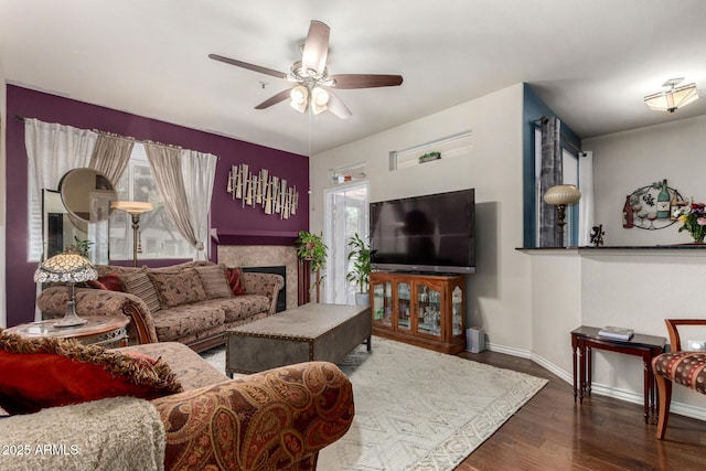 11375 E Sahuaro Dr Unit 1062, Scottsdale, AZ 85259 - living area with baseboards, a ceiling fan, wood finished floors, and a fireplace