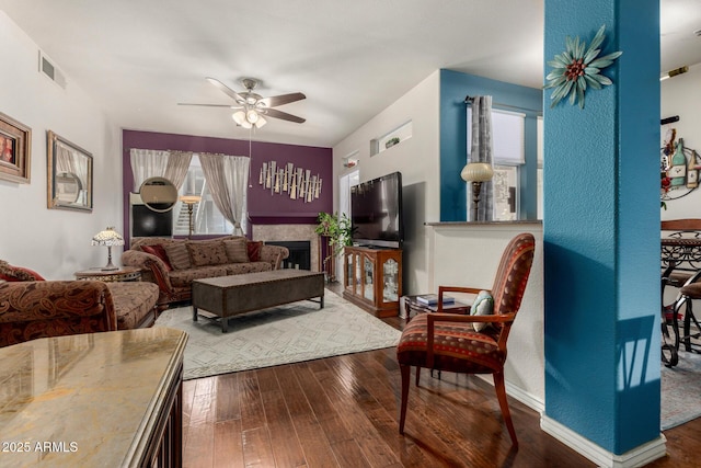 11375 E Sahuaro Dr Unit 1062, Scottsdale, AZ 85259 - living room featuring a ceiling fan, wood-type flooring, and a fireplace