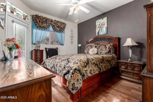 11375 E Sahuaro Dr Unit 1062, Scottsdale, AZ 85259 - bedroom with wood finished floors, access to outside, and a ceiling fan