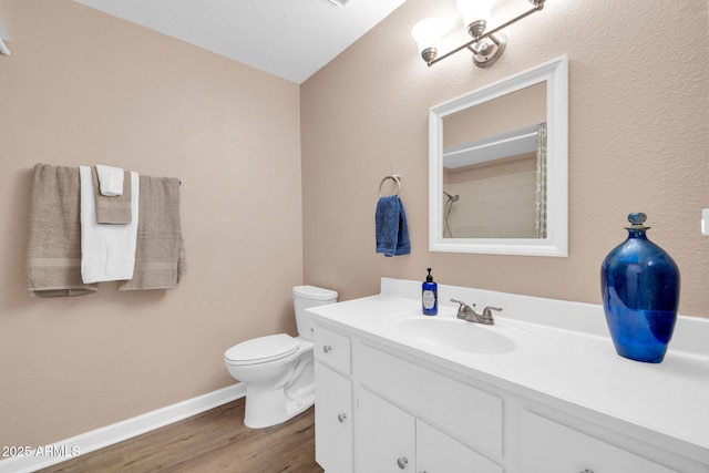 9639 W Cinnabar Ave Unit A, Peoria, AZ 85345 - full bath featuring vanity, wood finished floors, baseboards, and toilet